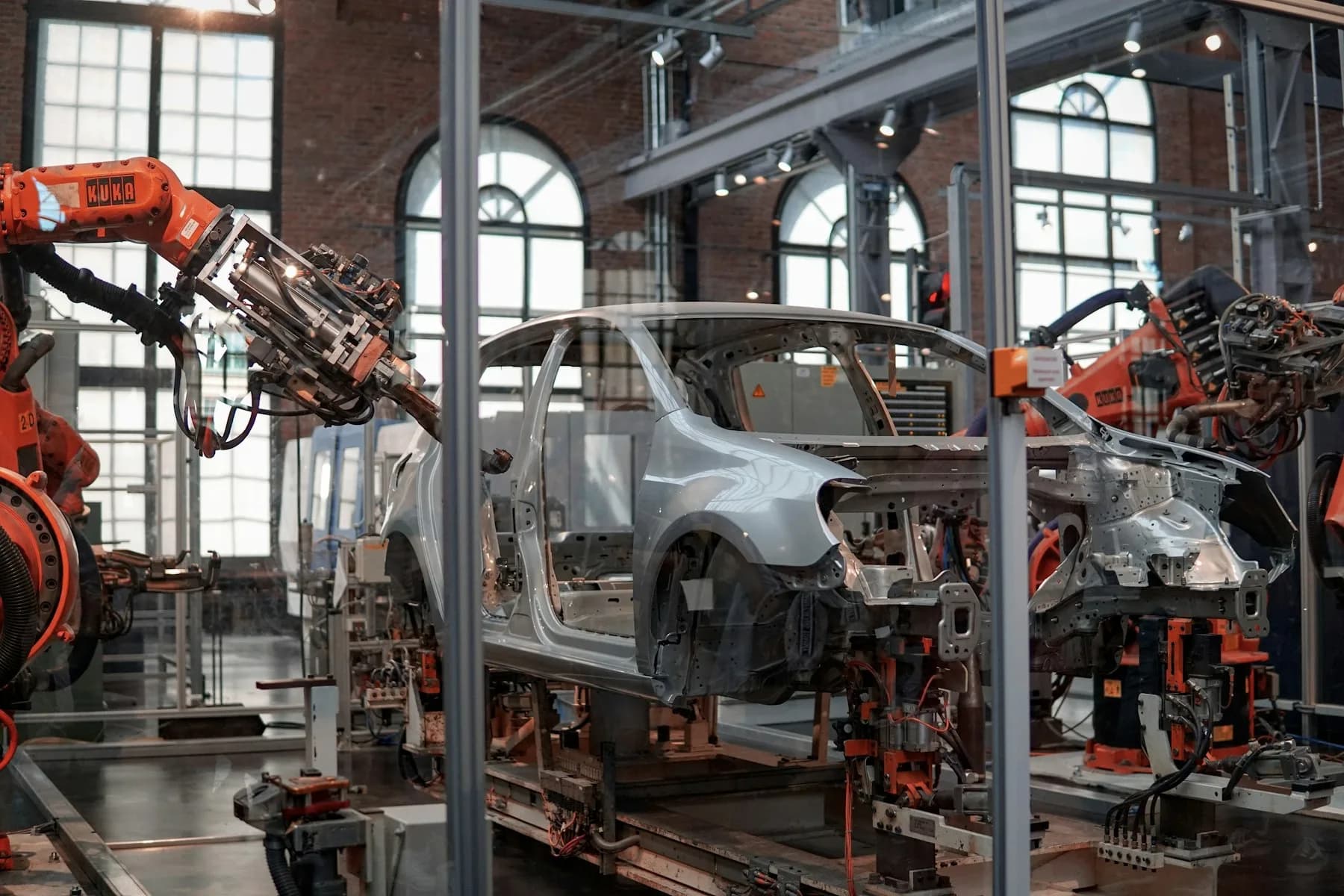 Vehicle bodies moving along an automated assembly line