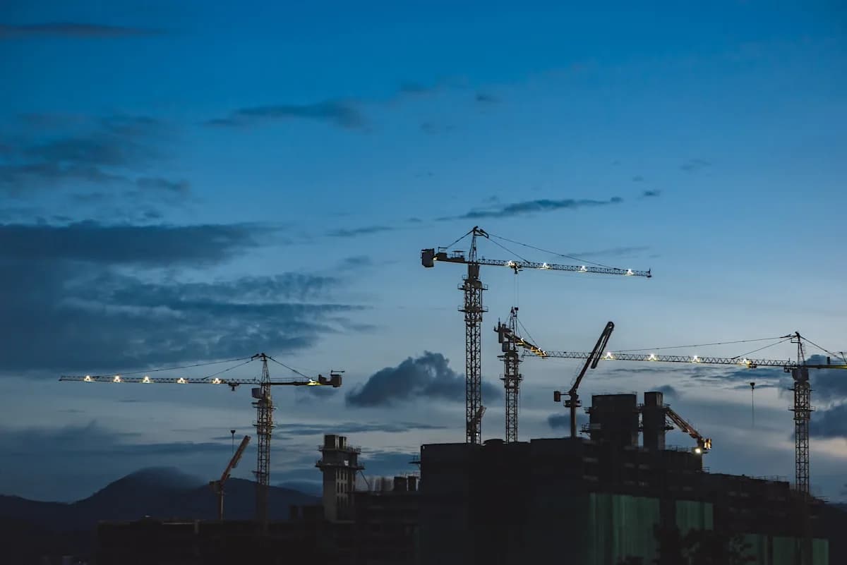 Tower cranes above a building under construction